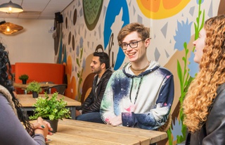 Students chatting in cafe