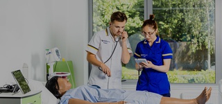 Nursing student with dummy