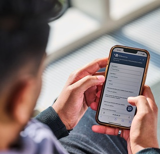 Student using their phone searching courses on University of Wolverhampton website