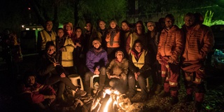 A group of refugees around the fire