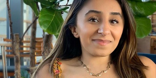 Portrait picture of woman Shani Dandi smiling at camera