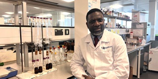Image of researcher, Dr Ojo, in a laboratory