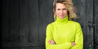 Rosie Stancer, endurance athlete, standing with arms folded