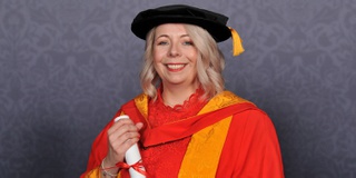 A portrait of Clare Roberts-Molloy with her award