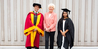 Staff and student with chamber patron