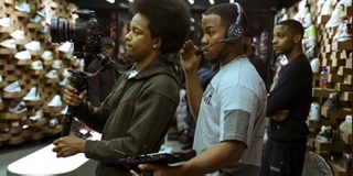 Alumni Theo Johnson shown working on a film set as he directs