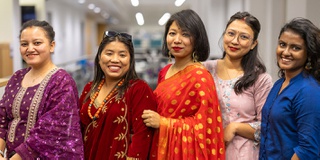 A group of Business Management International students lined up to celebrate Diwali