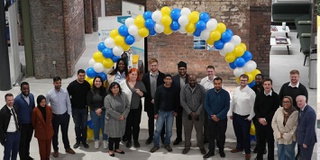 A group of Civil Engineering graduates looking at the camera