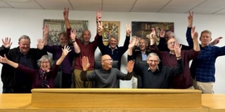 A group of visiting Law graduates in the School of Law court