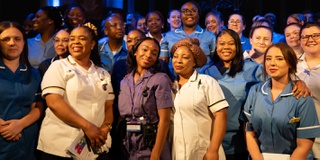 A group of newly qualified nurses celebrating at the badge ceremony