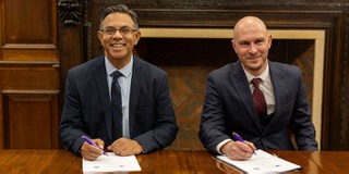 The Vice Chancellor and a representative from West Midlands Police sign a partnership agreement