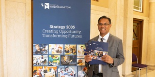 The Vice Chancellor standing outside of a University building