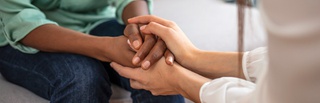 Banner image of two people holding hands
