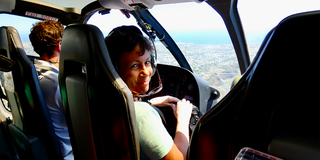 Catharine Cellier-Smart alumni in helicopter
