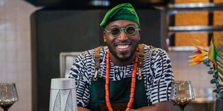 Portrait picture of graduate in his kitchen