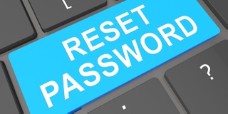 A graphic with the words Reset Password on a computer keyboard