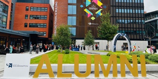 A picture taken in the City Campus courtyard with big WLV Alumni letters to celebrate graduation