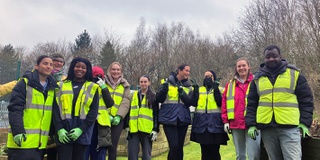 A group photo of Early Year students ready to plant trees at Walsall Campus