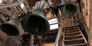 An image of some church bells interior