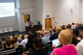 Professor Phil Gravestock speaking at the annual Inclusivity Conference 2025 photo taken from the audience perspective