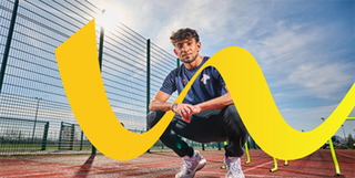 brand image sports student crouches on track