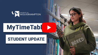 video thumbnail showing female student in library holding a book, looking at her phone, smiling. Text reads 