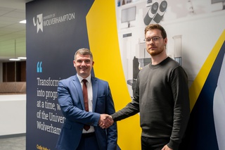 Dr Pete Cross, Chief Operating Officer at the University of Wolverhampton shakes hands with Councillor Chris Burden, Cabinet Member for City Development, Jobs and Skills, City of Wolverhampton Council at the Civic Centre
