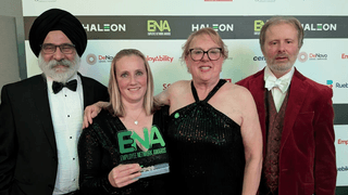 Four representatives from the University Ability Network of Wolverhampton receive the award for Outstanding