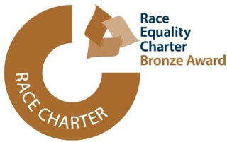 Race Equality Charter Bronze Award graphic, featuring a three quarter circle with the words 'race charter' in white. To the right the words Race Equality Charter appear in blue and under this, the words Bronze Award in bronze font.