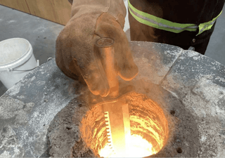 A knife being melted in a melting pot