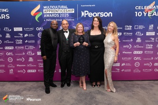 Representatives from the University of Wolverhampton (left to right) Javin Dacosta, Dean Starr, Jenny Cannon, Helen Stott and Amy Allen collect their trophy at the Multicultural Apprenticeship Awards 2025