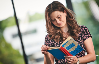 a female student reads a book