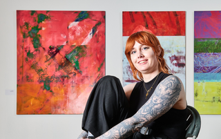 phd student in front of paintings