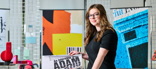 a female student sitting in the business school
