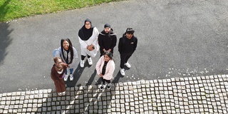 Students stood outside the front entrance of the School of Art