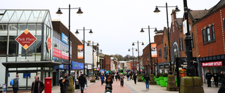The high street in Walsall town centre, with shops and shopping centres such as Park Place, Boots and Superdrug lining either side of the street