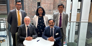 Group Shot of people signing a memorandum of understanding