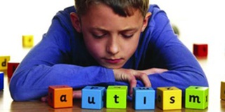 Child looking at autism blocks