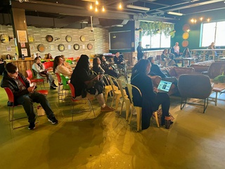 Staff and Student sitting in the City campus Luna Longue