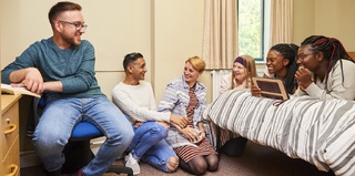 Students in the bedroom of a City Campus ensuite accommodation facility