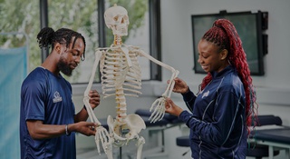 Students with skeleton at Walsall Campus