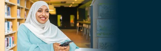 A photograph of a female student wearing a hijab, and browsing the University of Wolverhampton website on her mobile phone