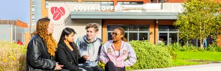 Students outside the courtyard at City campus