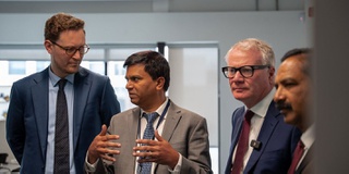 An image showing academics talking to people at a Ministerial visit to Springfield