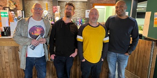 A group of returning graduates in the Students' Union bar